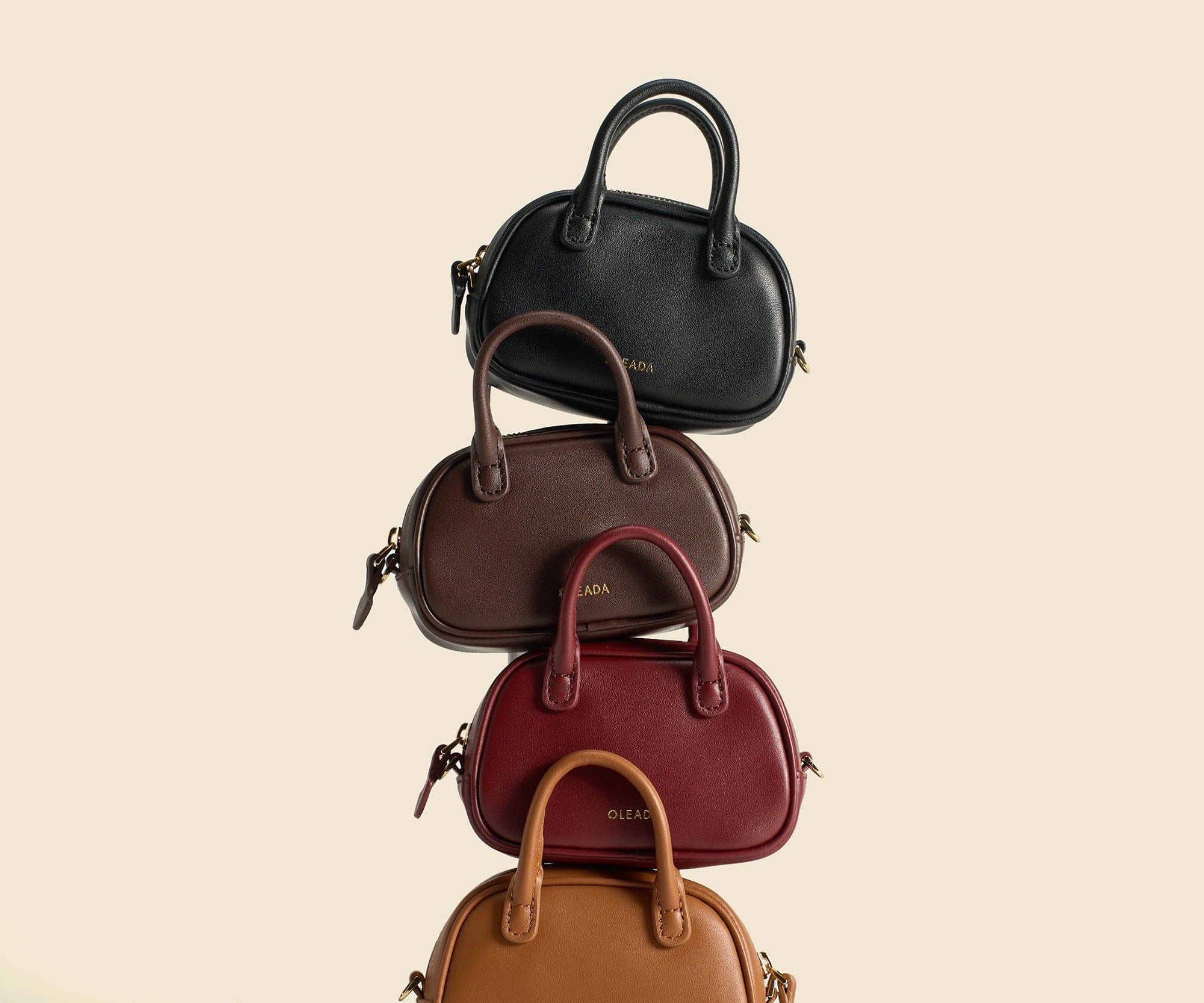 OLEADA NYC Apparel and Accessories > Women > Small Leather Goods > Leather Case Marina Carryall Charm