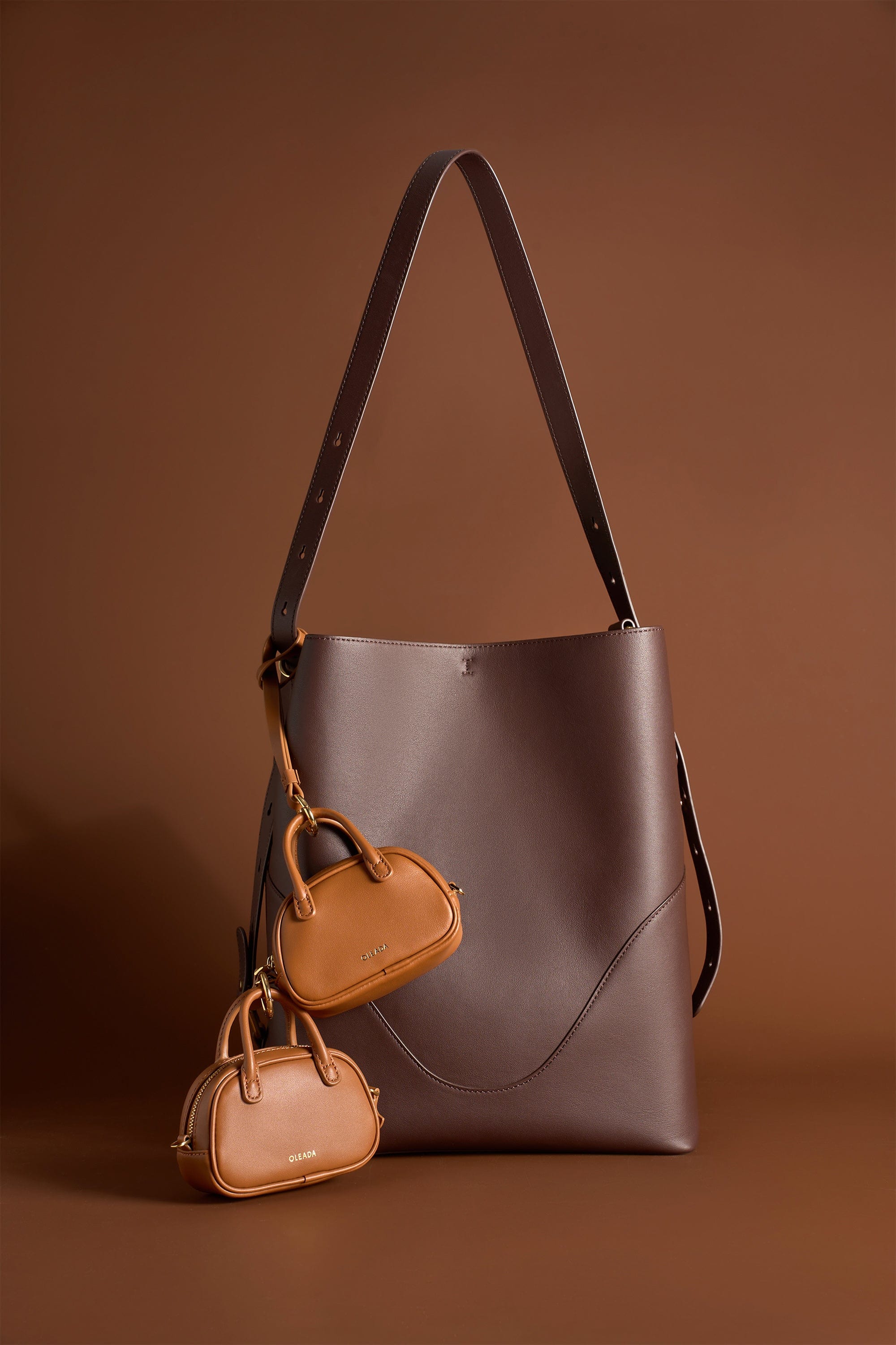 OLEADA NYC Apparel and Accessories > Women > Small Leather Goods > Leather Case Marina Carryall Charm