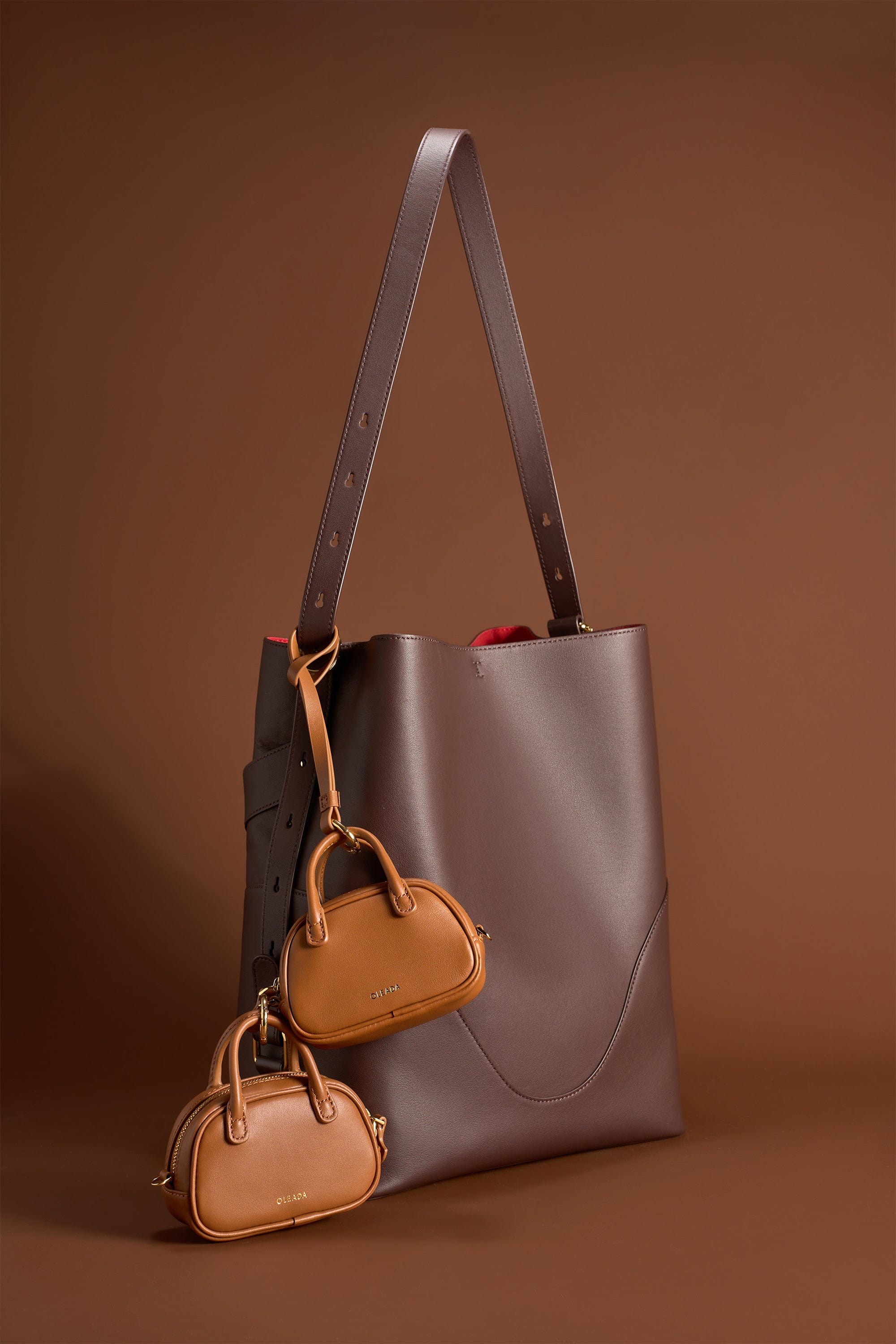 OLEADA NYC Apparel and Accessories > Women > Small Leather Goods > Leather Case Marina Carryall Charm