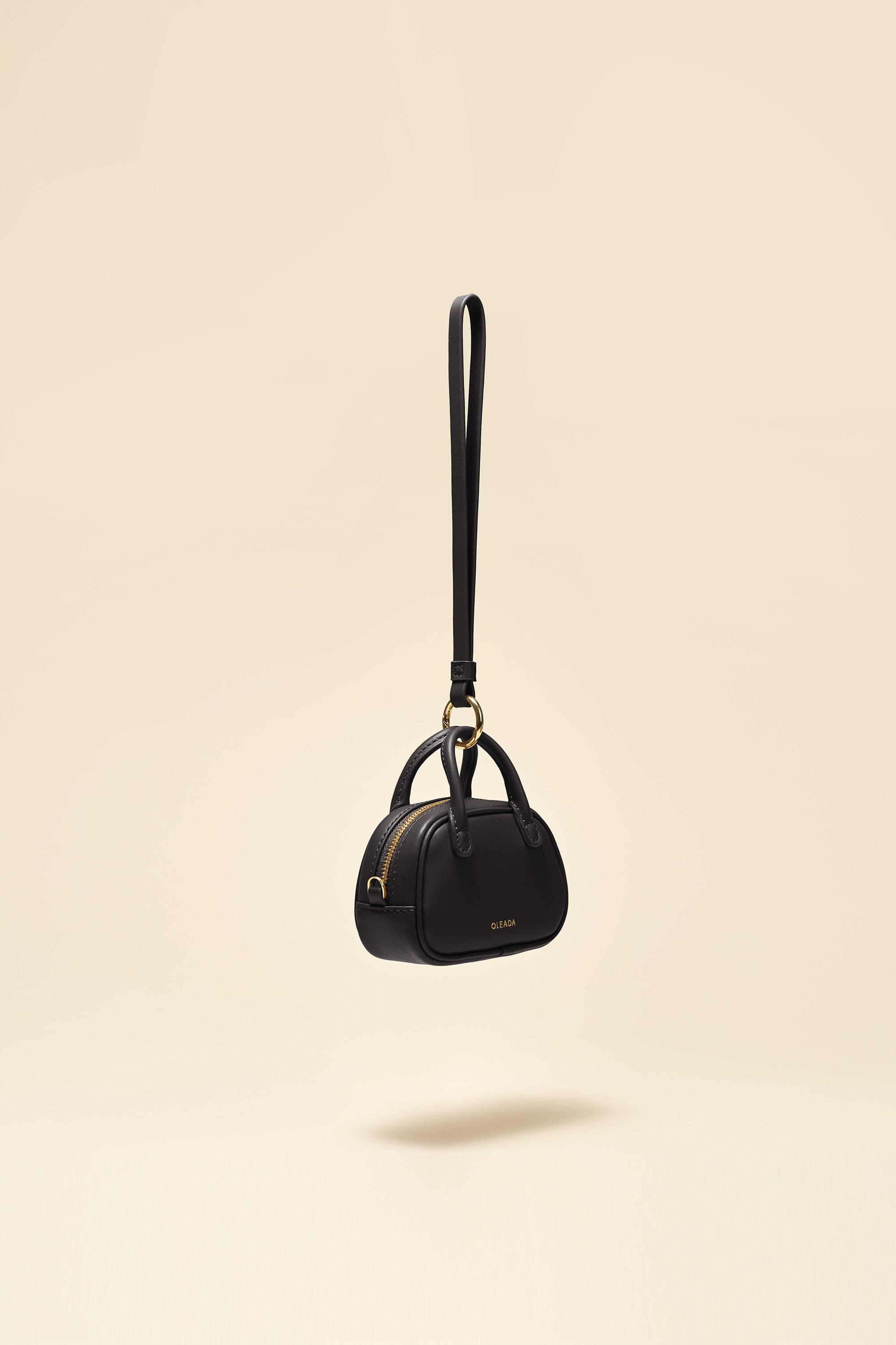 OLEADA NYC Apparel and Accessories > Women > Small Leather Goods > Leather Case Marina Carryall Charm
