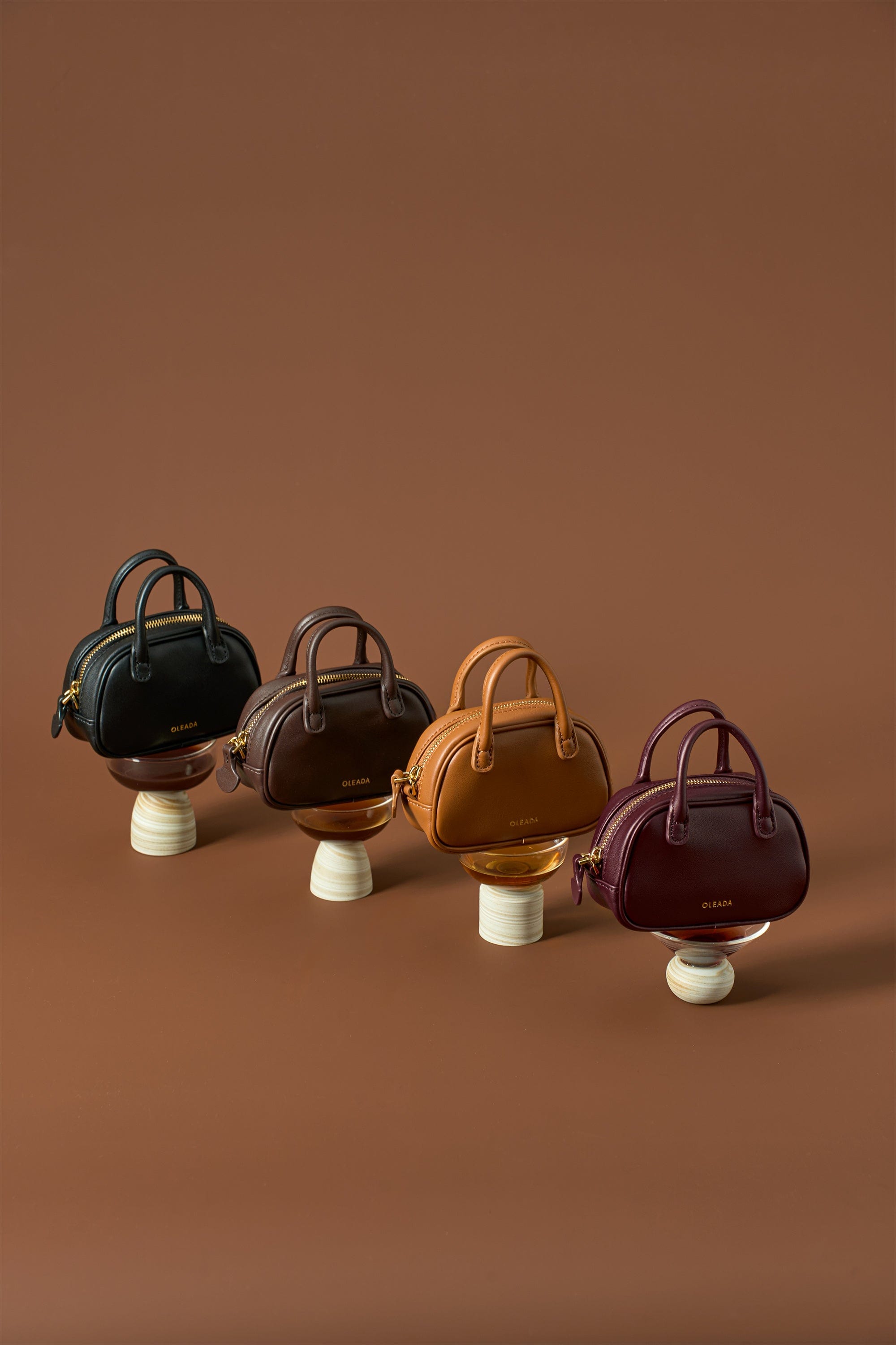 OLEADA NYC Apparel and Accessories > Women > Small Leather Goods > Leather Case Marina Carryall Charm