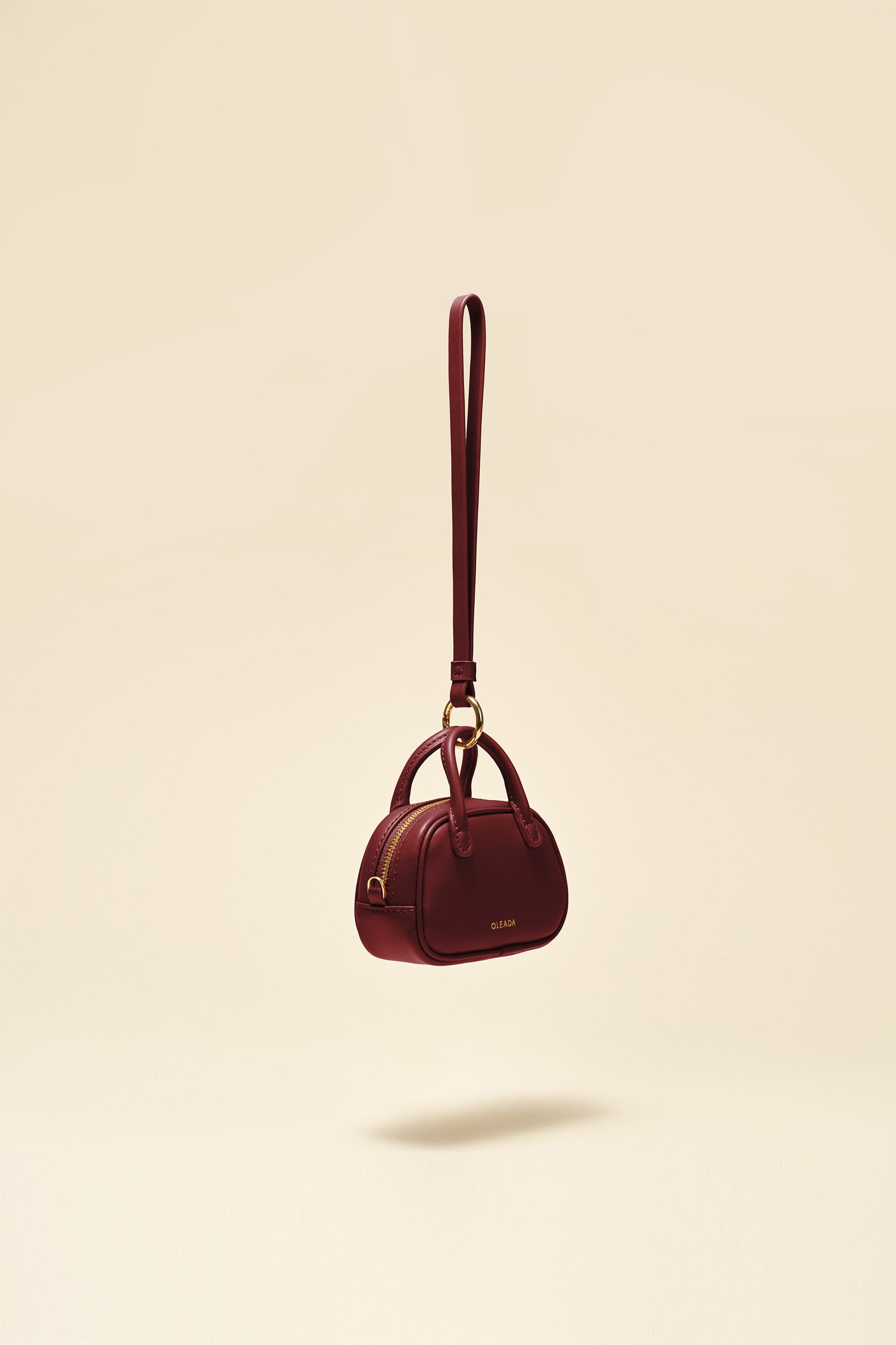 OLEADA NYC Apparel and Accessories > Women > Small Leather Goods > Leather Case Marina Carryall Charm