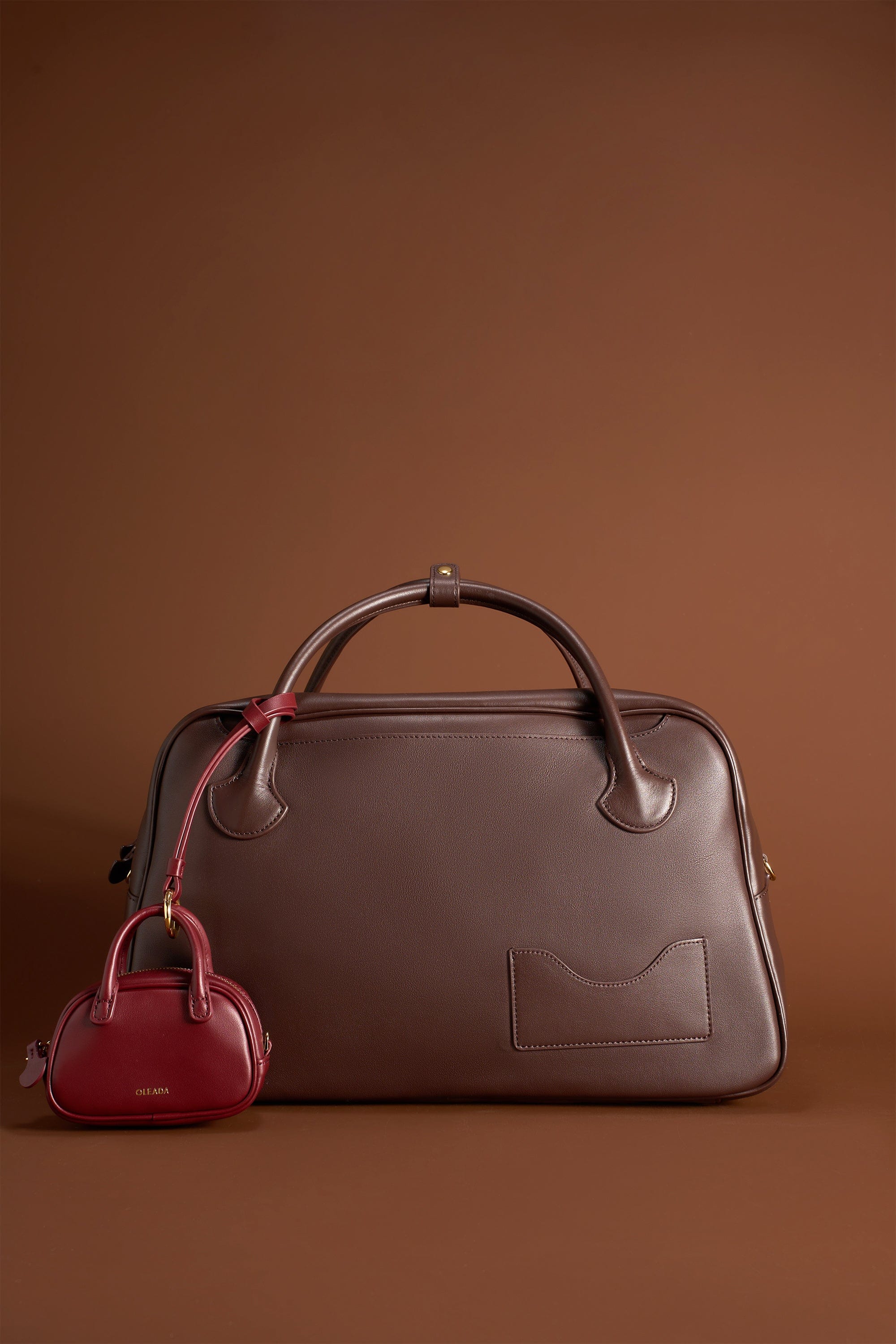 OLEADA NYC Apparel and Accessories > Women > Small Leather Goods > Leather Case Marina Carryall Charm