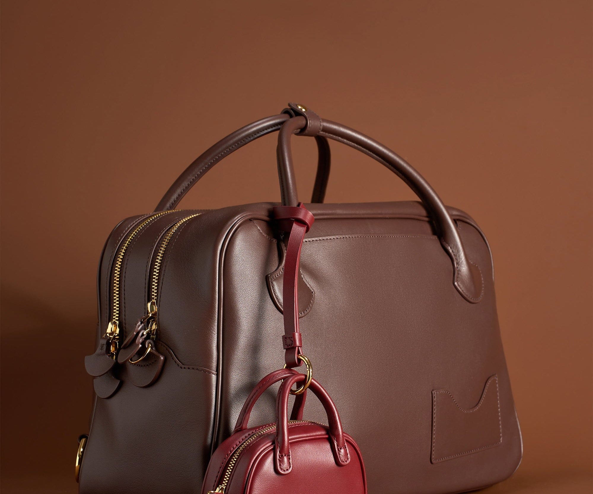 OLEADA NYC Apparel and Accessories > Women > Small Leather Goods > Leather Case Marina Carryall Charm