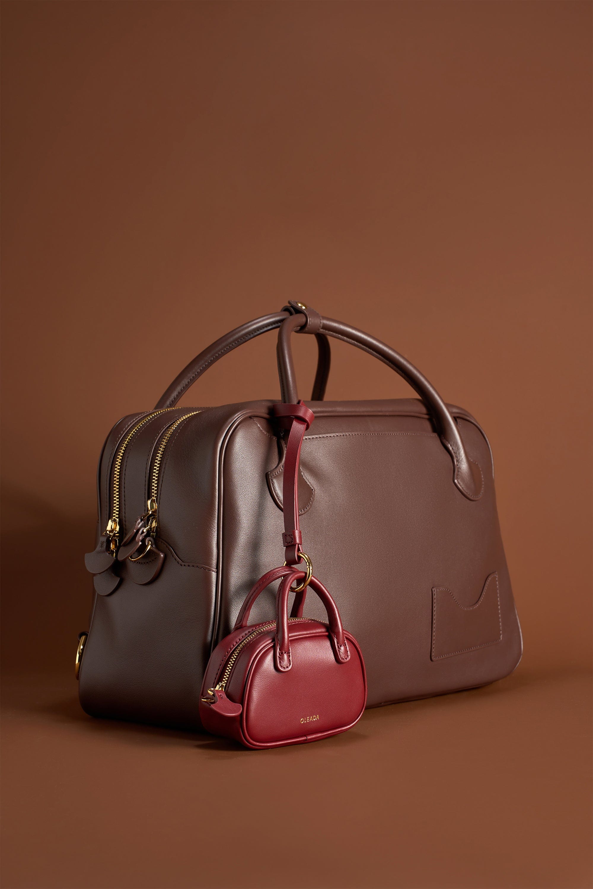 OLEADA NYC Apparel and Accessories > Women > Small Leather Goods > Leather Case Marina Carryall Charm