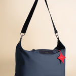 OLEADA NYC convertible travel bags > airport tote bags > overnight bags > water-resistant vegan bags > stylish multi-use bags AnyWear AnyDuffle Travel