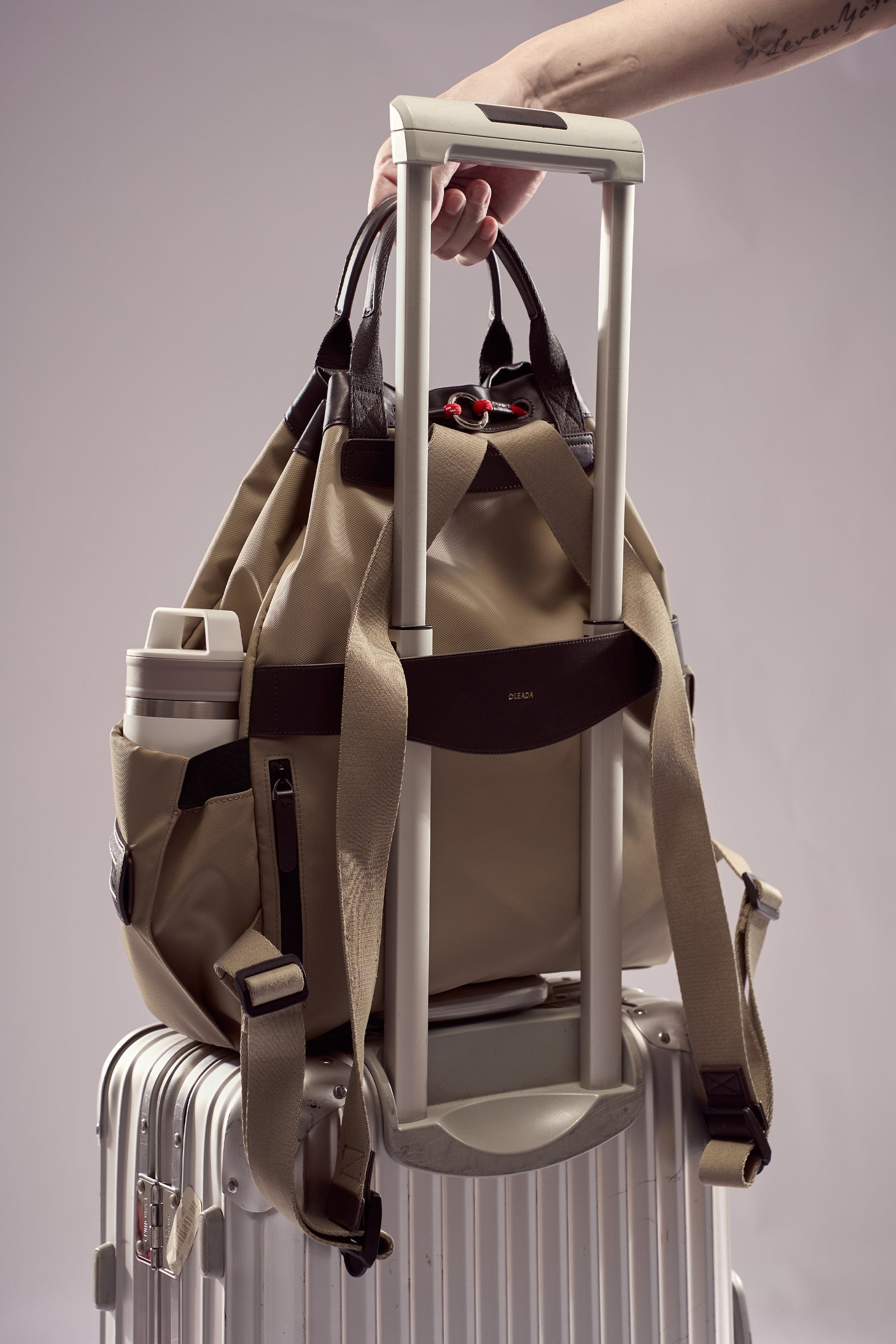 OLEADA NYC convertible travel bags > work-to-travel backpack > commuter bags > water-resistant vegan bags > stylish multi-use backpack Color_Abu Dhabi AnyWear Tennis Backpack