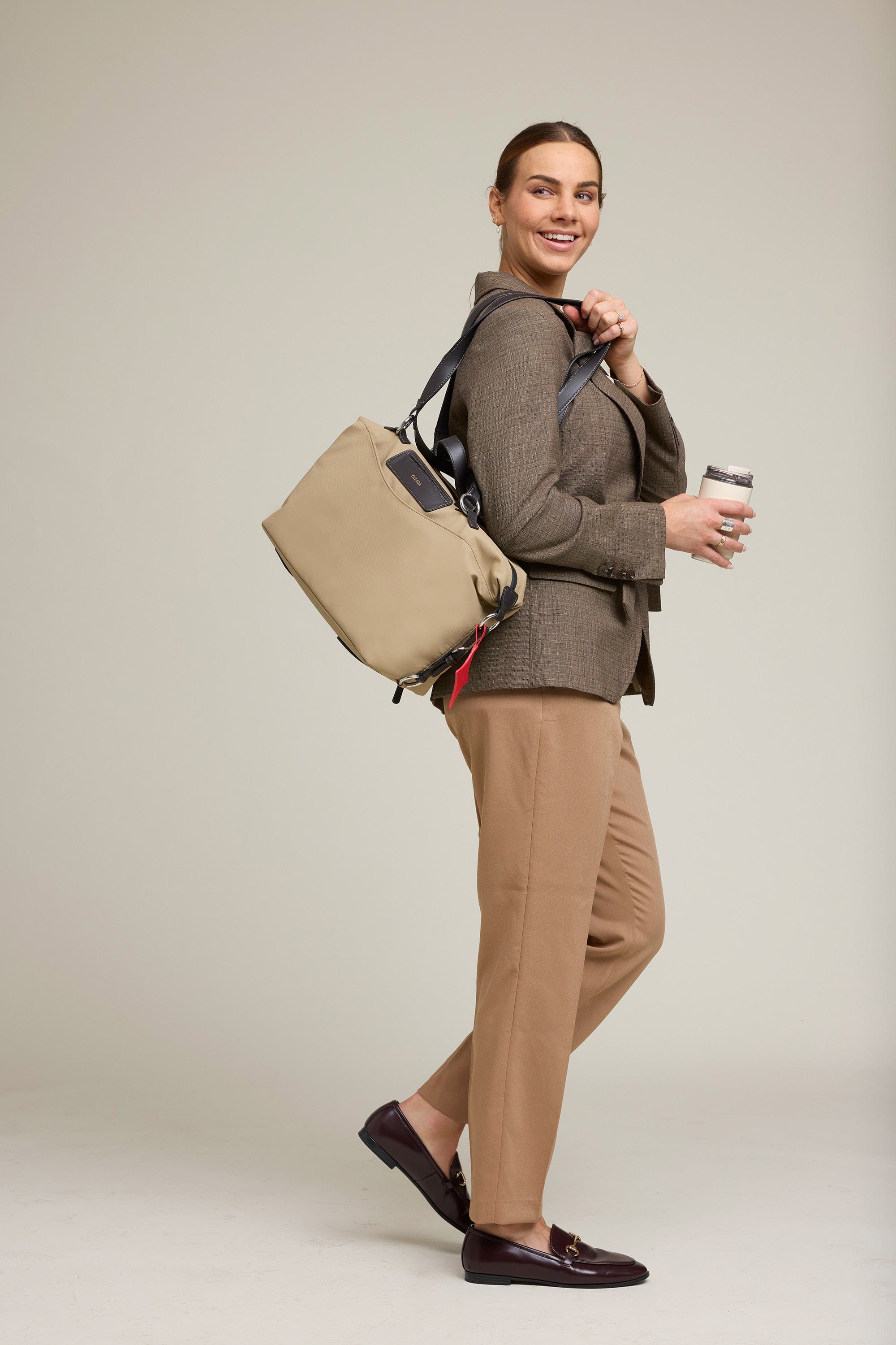 OLEADA NYC Convertible Travel Bags > Work-to-Travel Duffle Bags > Organized Carry Bags > Water-Resistant Vegan Bags > Stylish Multi-Use Bags Color_Tan Anywear AnyDuffle City