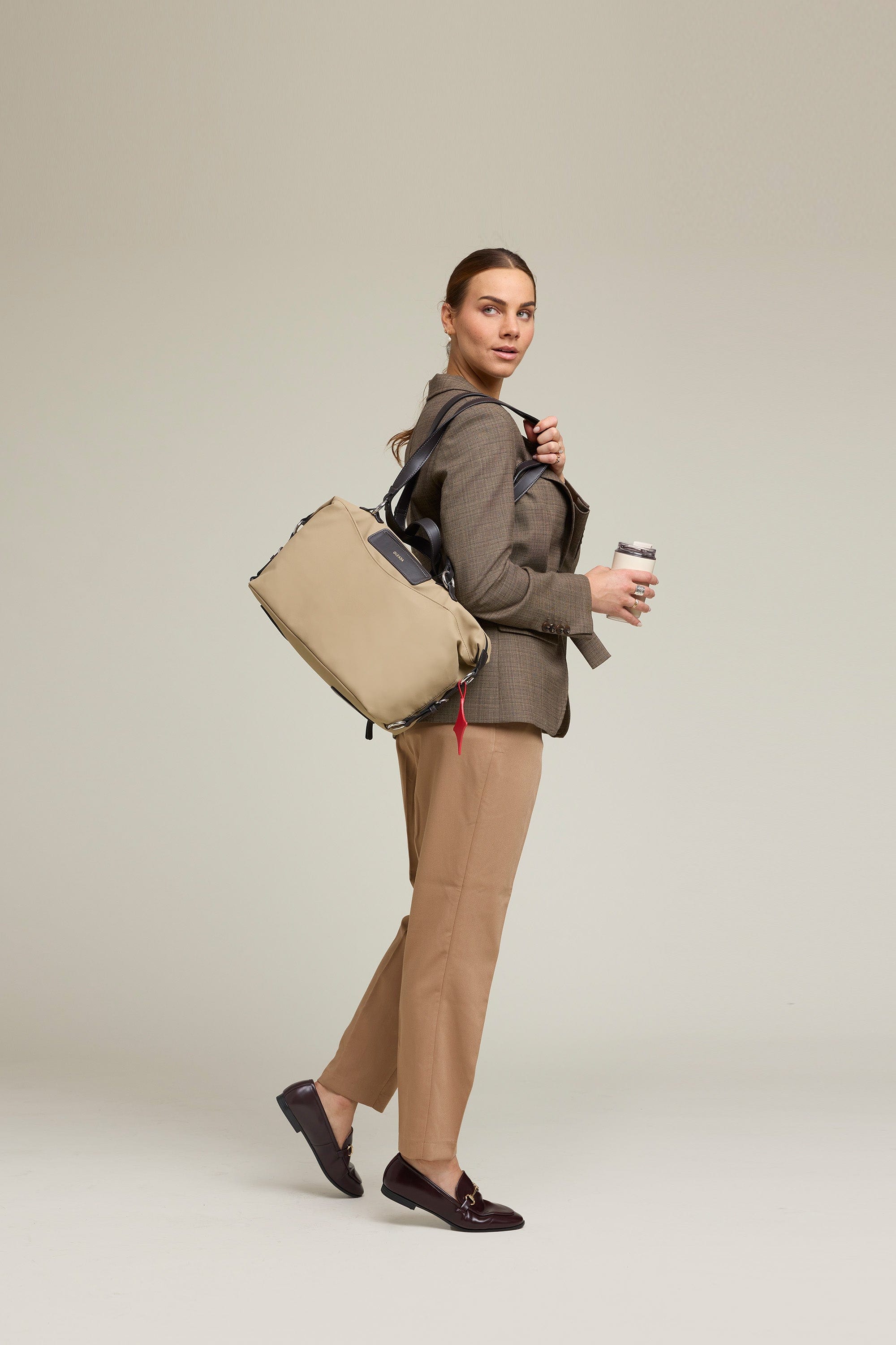 OLEADA NYC Convertible Travel Bags > Work-to-Travel Duffle Bags > Organized Carry Bags > Water-Resistant Vegan Bags > Stylish Multi-Use Bags Color_Tan Anywear AnyDuffle City