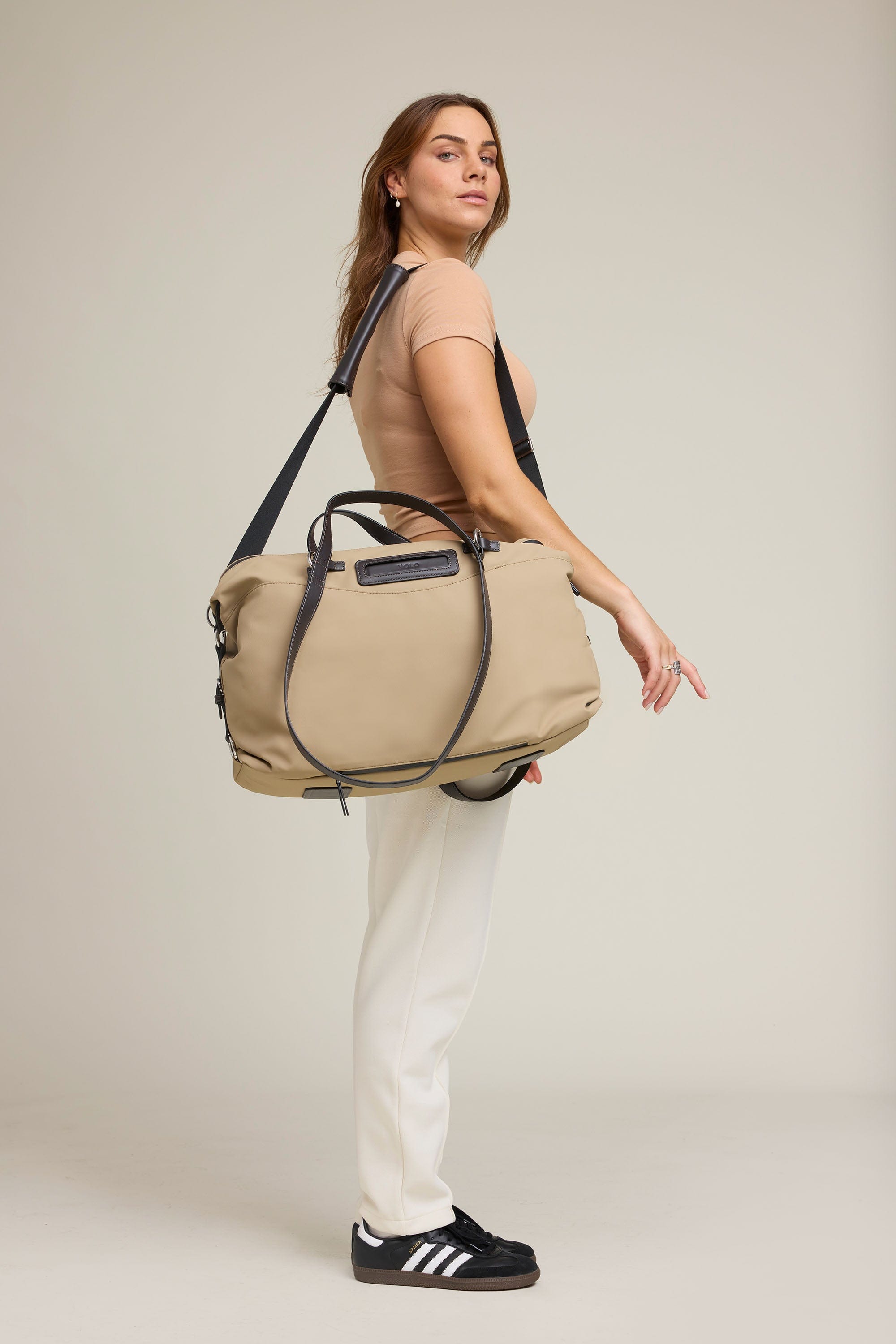 OLEADA NYC Convertible Travel Bags > Work-to-Travel Duffle Bags > Organized Carry Bags > Water-Resistant Vegan Bags > Stylish Multi-Use Bags Color_Tan Anywear AnyDuffle Travel