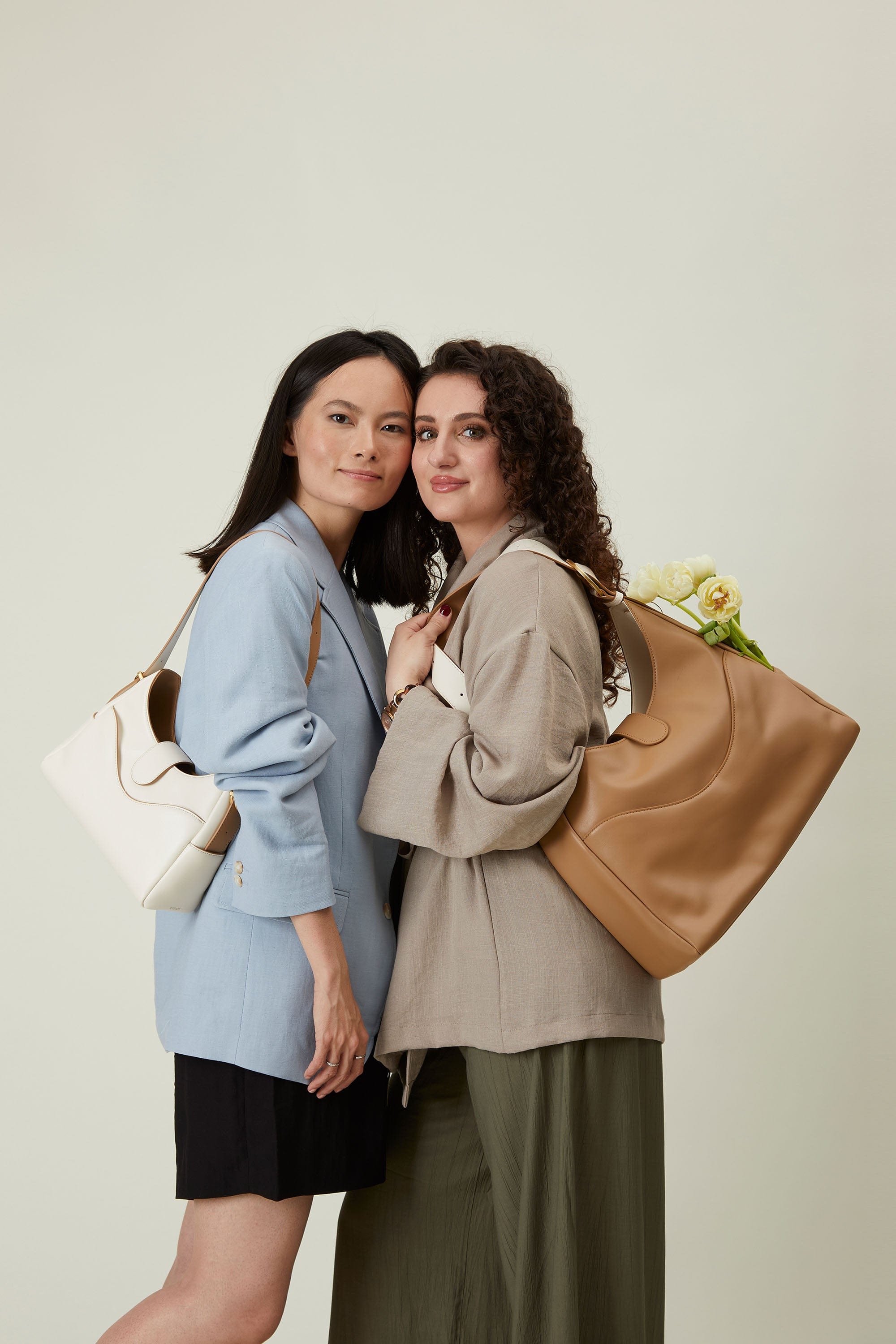 OLEADA NYC Mini Hobo Bag > Women Leather Bag For All Occasions > multiple interior and exterior pockets with a laptop compartment > 13 inch laptop bag > convertible to shoulder bag Reverie Hobo