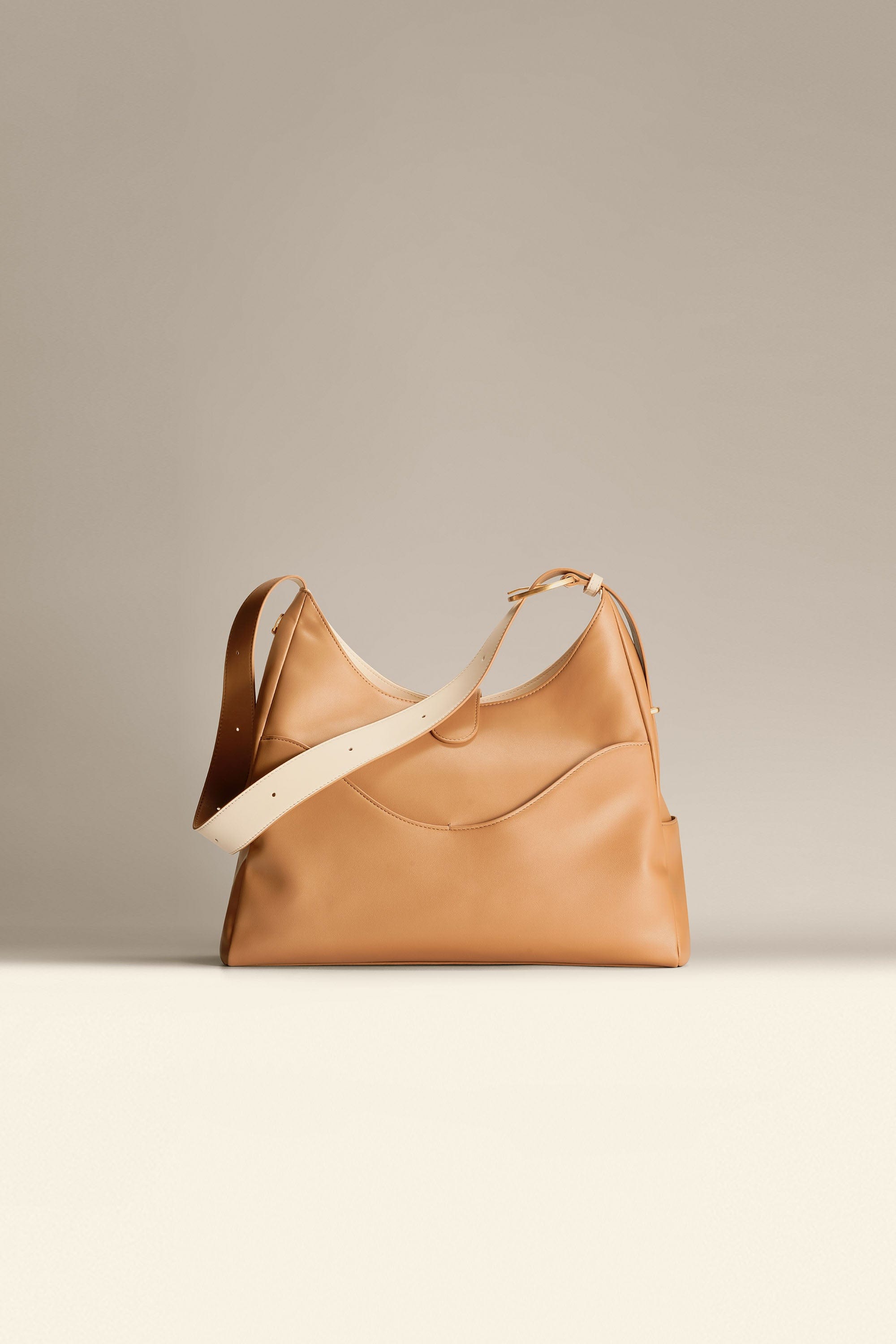 OLEADA NYC Mini Hobo Bag > Women Leather Bag For All Occasions > multiple interior and exterior pockets with a laptop compartment > 13 inch laptop bag > convertible to shoulder bag Reverie Hobo