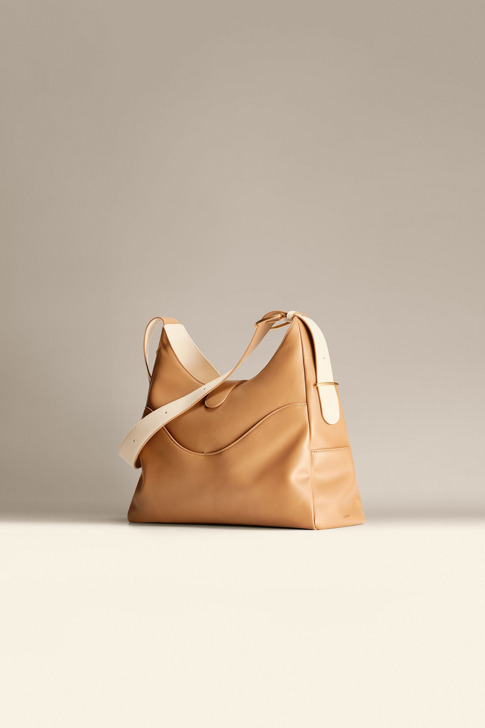 OLEADA NYC Mini Hobo Bag > Women Leather Bag For All Occasions > multiple interior and exterior pockets with a laptop compartment > 13 inch laptop bag > convertible to shoulder bag Reverie Hobo