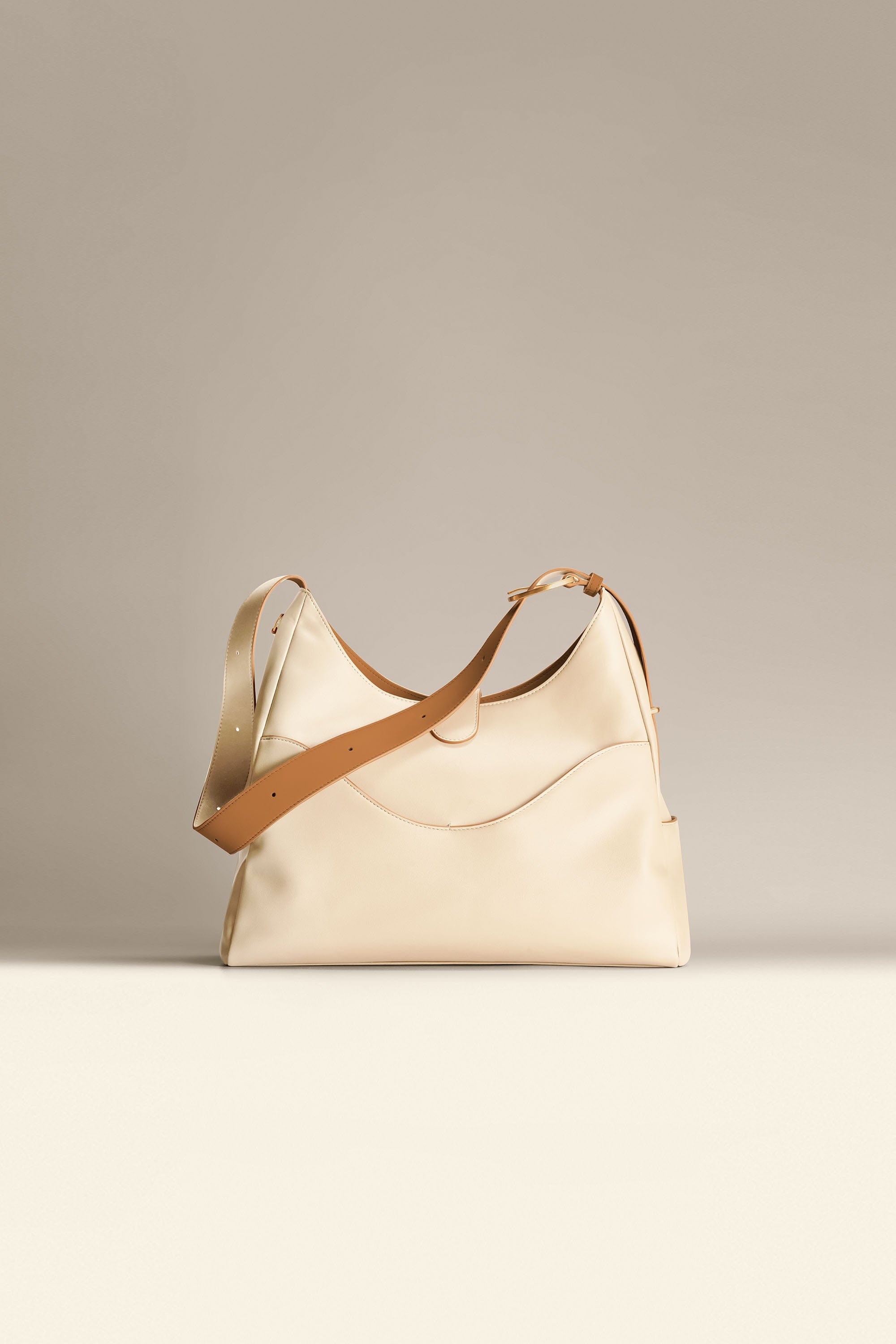 OLEADA NYC Mini Hobo Bag > Women Leather Bag For All Occasions > multiple interior and exterior pockets with a laptop compartment > 13 inch laptop bag > convertible to shoulder bag Reverie Hobo